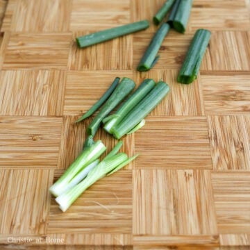 Wash green onions and pat dry with paper towels. Trim off the roots, split them down the middle and chop into 2-inch-long pieces. Set aside.