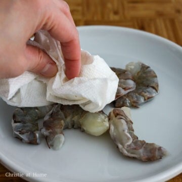 Then pat dry the squid rings and shrimp with paper towel to remove excess moisture and set aside.
