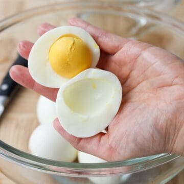 run a knife around the yolk to separate egg white and yolks