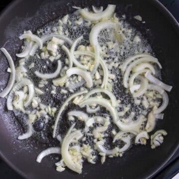 Heat a large pan on medium heat and melt butter. Sauté garlic and onions until softened, about 1-2 minutes
