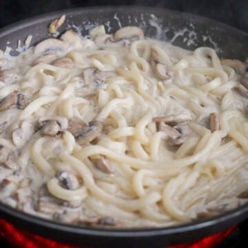 Once sauce has thickened a bit. Toss in strained udon noodles and cook for 2 minutes.