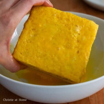 Lightly coat each sandwich in the beaten eggs.