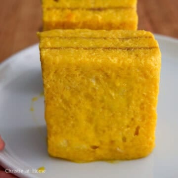 Vertically rest the sandwiches on a plate.