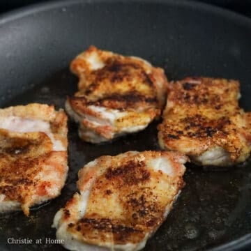 Heat vegetable oil in a large pan on medium heat. Once hot, place the chicken skin-side down and cook until the skin is golden brown, about 4-5 minutes. Flip and cook the other side for 2 minutes, or until the meat is cooked through and reaches an internal temperature of 165°F.