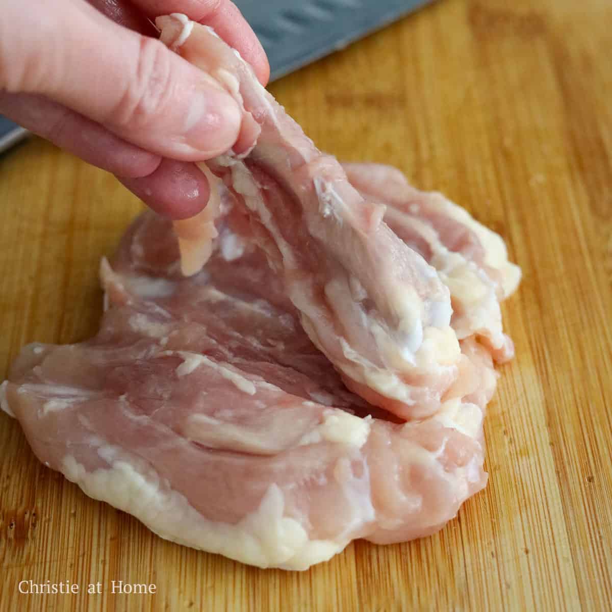 Debone the chicken thighs by placing them bone-side up on a cutting board. Then locate the bone and make small slits around the bone with a sharp knife until you’re able to easily remove it.
