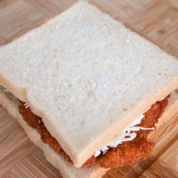 Close the sandwich with a slice of bread.