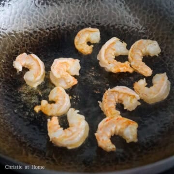 In a large pan medium high heat, add 1 tablespoon oil and the shrimp. Fry until 50% cooked. Remove and set aside.