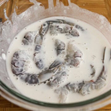 Mix shrimp into the batter ensuring it's fully coated.