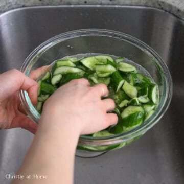 Rinse the cucumbers under cold running water a few times to remove excess salt.