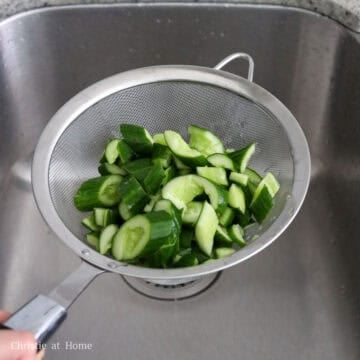 Next strain the cucumbers and shake out any excess water.