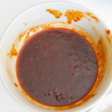 Next in a small bowl, whisk together your sauce ingredients until well combined. Pour the sauce and stock into the pan.