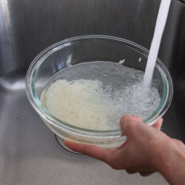 Rinse rice until water runs clear and strain. 