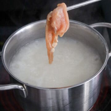 Add chicken, ginger and scallions and cook the chicken.