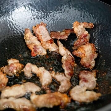 In a large pan, heat vegetable oil on medium heat. To check if the oil is hot enough, place a wooden chopstick and look for bubbles. Then carefully lower in pork and fry until golden crispy brown on each side, about 8-9 minutes in total adjusting the heat as needed.