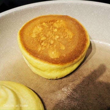 Cook pancakes for 5-6 minutes on each side until golden brown and cooked on the inside. If they're still mushy inside, cook for another 2-3 minutes. If the pancake is undercooked, it can also cause for deflated pancakes. Serve hot and enjoy with your favourite toppings!