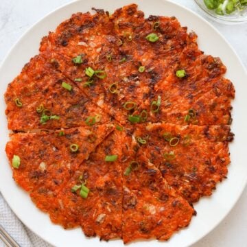 Remove off heat. Transfer to a cutting board to slice or cut with clean kitchen scissors. Garnish with more green onions and enjoy!