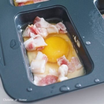 Evenly sprinkle chopped bacon, shredded cheese, dried parsley flakes and a pinch of salt and black pepper to each muffin mold.