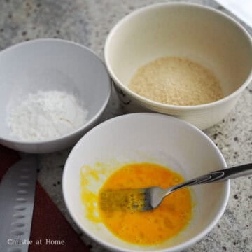 Then prepare fill one large shallow bowl with cornstarch, a second bowl with beaten egg and the third bowl with panko breadcrumbs.
