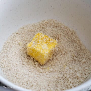 Generously coat each seasoned tofu cube into the cornstarch first, then beaten egg and panko breadcrumbs last ensuring no bald spots.