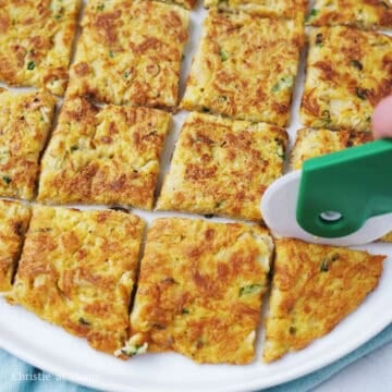 Slice the pancake with a pizza cutter/clean kitchen scissors or transfer to a cutting board and slice into smaller pieces with a sharp knife.