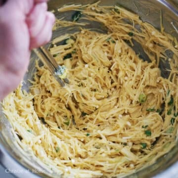 In a large mixing bowl, combine chopped enoki mushrooms, eggs, all-purpose flour, cornstarch, green onions, salt, and black pepper. Mix until well combined and sticky.