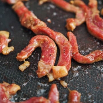 Heat vegetable oil in a large pan on medium high heat. Fry marinated beef until 75% cooked.