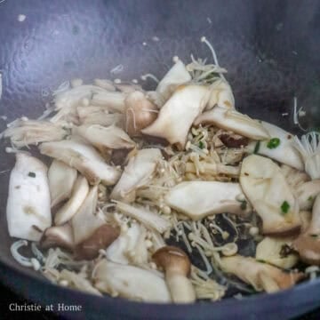 Increase to medium-high heat, stir-fry king mushrooms and enoki until the mushrooms have softened.