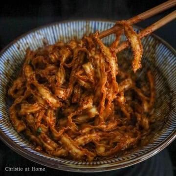 Transfer hot noodles into bowl with sauce and mix until each noodle is coated in hot sauce. Enjoy!
