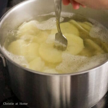Then bring a large pot of hot water to a boil on medium-high heat. Boil sliced potatoes for 10-15 minutes or until fork tender.