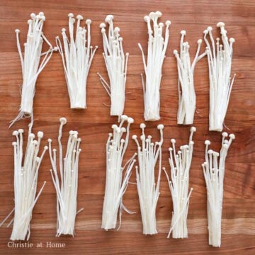 Slice off ½-inch of the base for the enoki mushroom. Rinse it off with cold water and pat dry. Divide the mushroom into 12 bunches, each around ½ to ¾ inch wide in diameter. You may have some mushrooms leftover. Set aside.