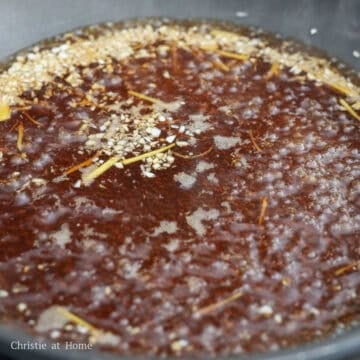 Add the broth ingredients as listed above into a large pan. Stir to dissolve the sugar and bring to a rolling simmer on medium heat.Â