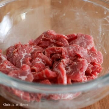 In a large bowl, marinate sliced beef with marinade ingredients as listed above for at least 15 minutes at room temperature.