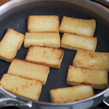 Heat vegetable oil in a large pan on medium heat. Pan fry tofu pieces on both sides until golden, about 2-4 minutes per side.
