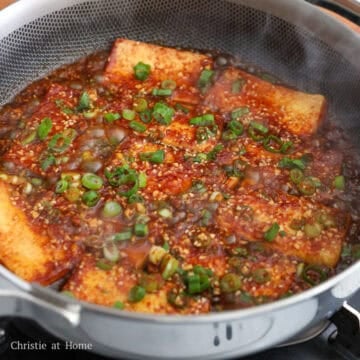 Then pour the sauce over the tofu and cook for 3-4 minutes or until sauce has reduced. Garnish with more green onions and serve with steamed rice.Â