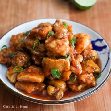 Transfer chicken to a large bowl. Pour the sauce over top. Gently toss to mix. Garnish with green onions. Enjoy!