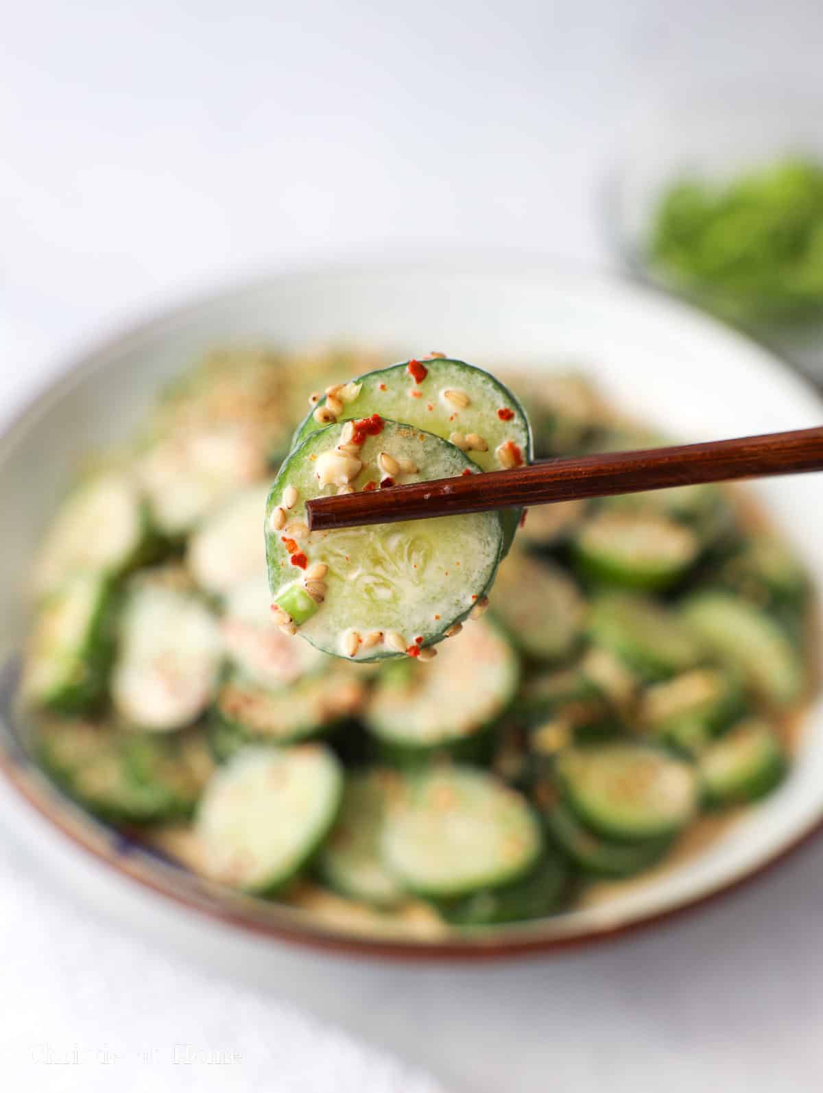 a closeup image of kewpie mayo cucumber salad