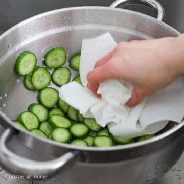 Next rinse with cold running water at least 5-6 times to remove the excess salt or they will be very salty. Strain and shake out the excess water. Pat them dry with paper towels. Then transfer to a clean large bowl.