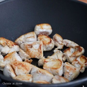 Heat vegetable oil in a large pan on medium heat. Brown seasoned chicken until golden brown on both sides, about 5-6 minutes in total. Do not cook it through yet. Remove and set aside.