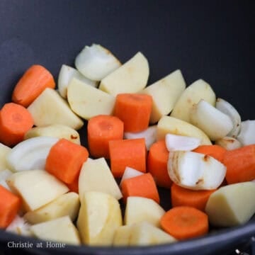 Add onions, carrots and potatoes into the pan and cook for 2 minutes.